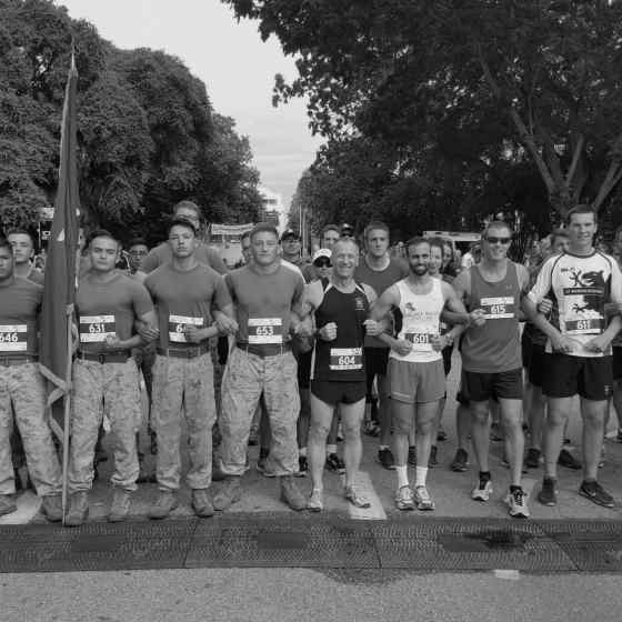 Defence and Services runners including the US Marines link up to show their support and say NO MORE to family violence. 