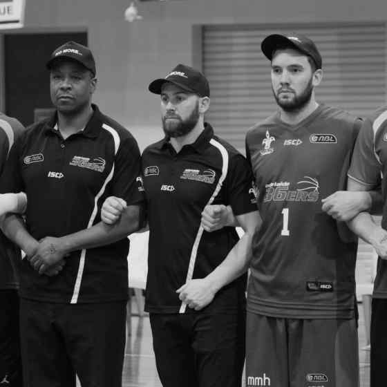 Adelaide 36ers proudly wear their NO MORE family violence caps before their game against Townsville Crocs at Palmerston Rec Centre.