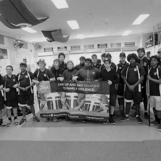 Centralian Middle School Clontarf boys link up after an education session about family violence.