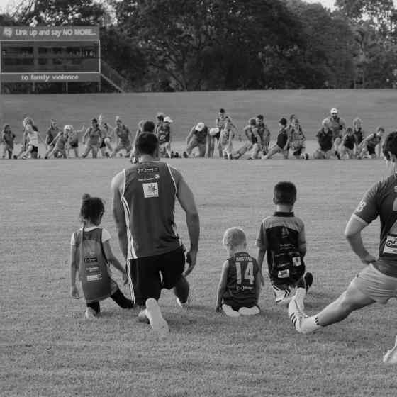 Leading by example, a father spends the training session with his children. Promoting positive and healthy relationships is so important for the juniors coming up through the ranks of football teams.