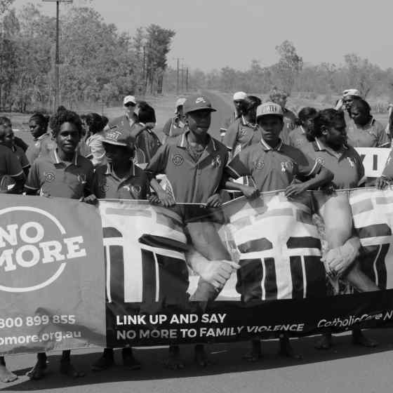 Community members marching in support of NO MORE family violence. 