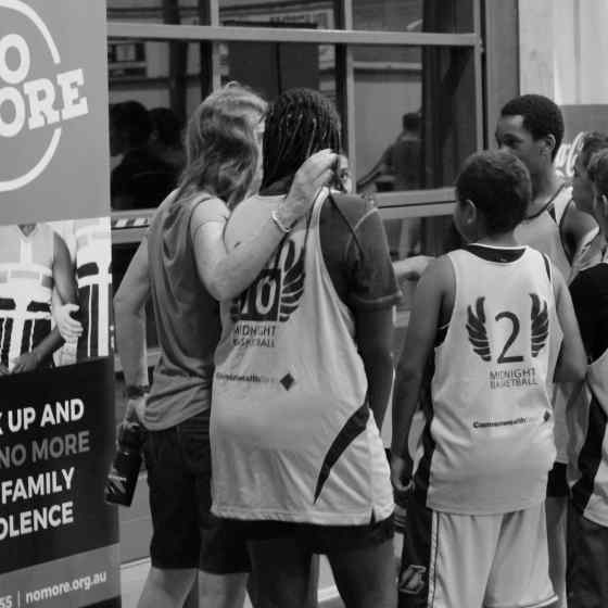 The Mighty Bombers have a team talk with coaches before their quarter final game.