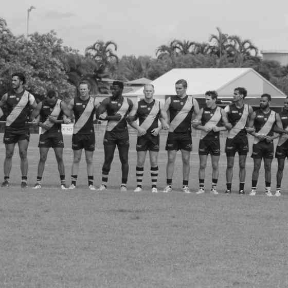 Nightcliff FC link up on the ground before the start of the game. Photo Credit: Lou Reeve