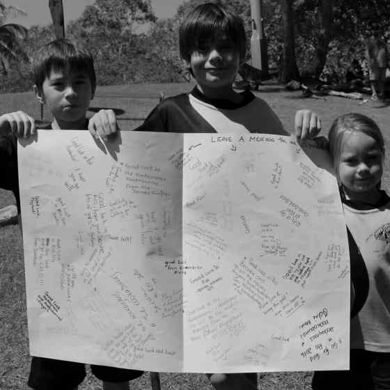 Kids write messages to the Hockeyroos at the Rio Olympics.
