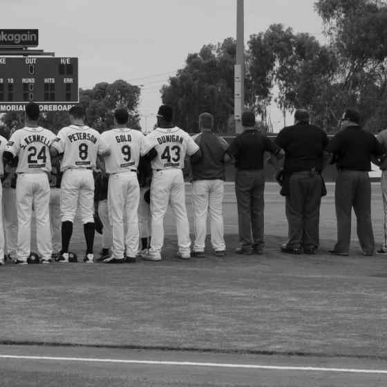 Perth Heat, Canberra Cavalry and umpires link up on the mound. Photo Credit: Wendy De'Souza
