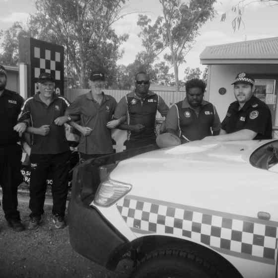 Launching Ti Tree Rooster's Domestic Violence Action Plan from L to R: Adam Davey (NT Police), Roy Arbon (NO MORE), Stan Coombe (NO MORE), Wayne Scrutton (Ti Tree Roosters Coach), Morgan Abbott signing (Ti Tree Roosters Assistant Coach), Jared Porch (NT Police)