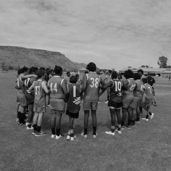 Centralian Middle School and Yirara College link up before the Grand Final match.