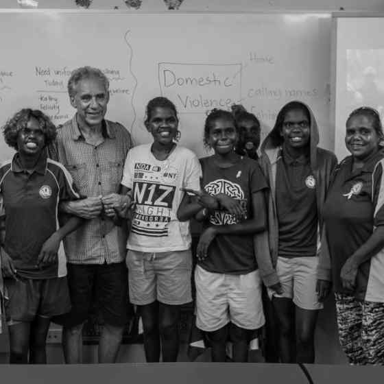 Charlie King links up with students from Maningrida school. Photo Credit: NT Police