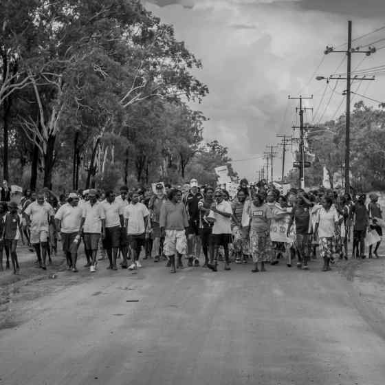 A community march took place through the street of Maningrida with people chanting 'NO MORE family violence'. Photo Credit: NT Police