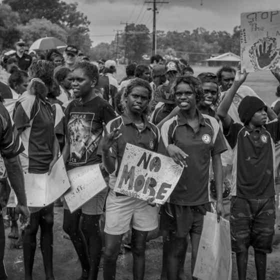 A community march took place through the street of Maningrida with people chanting 'NO MORE family violence'. Photo Credit: NT Police