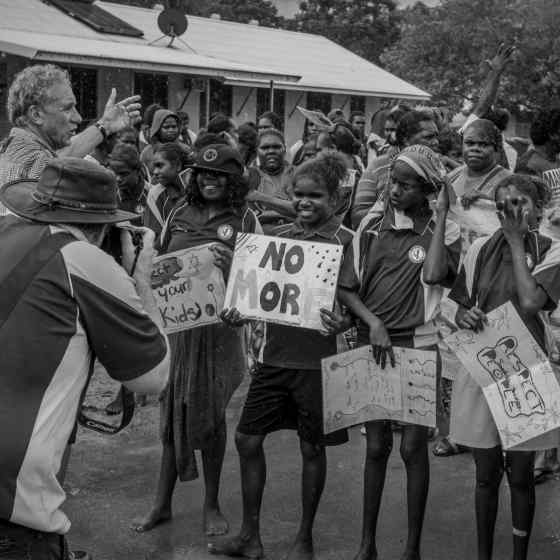  A community march took place through the street of Maningrida with people chanting 'NO MORE family violence'. Photo Credit: NT Police