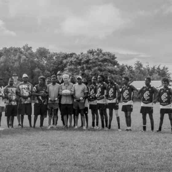 Swans and Blues link up prior to their community match to send a message to their fellow community members that they say NO MORE to family violence. Photo Credit: NT Police