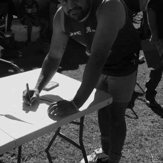 Eric Campbell signs the Pioneer DVAP committing to address issues of family violence within their team.