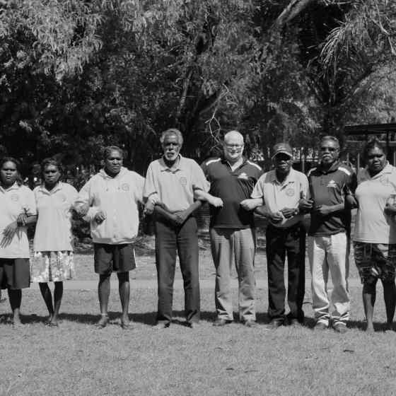 Remote Area School Attendance Officers from Tiwi Islands and Wadeye link arms to say NO MORE to family violence.