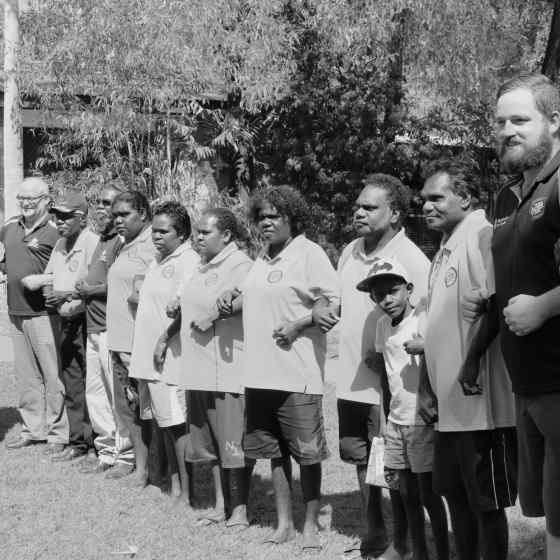 Remote Area School Attendance Officers from Tiwi Islands and Wadeye link arms to say NO MORE to family violence.