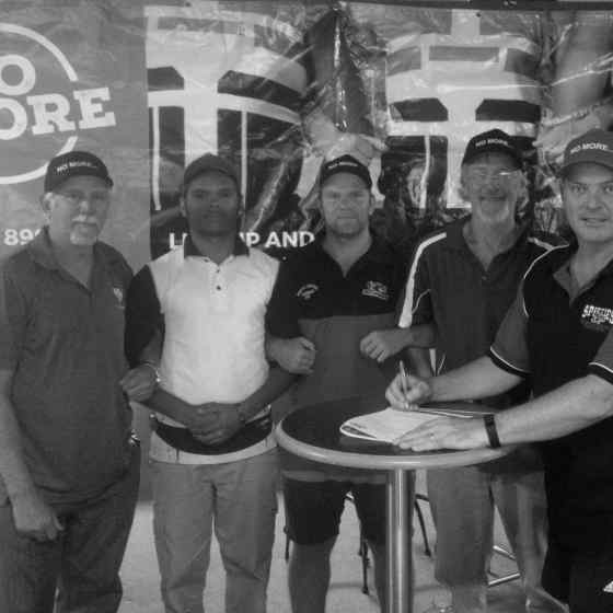 Sporties Spitfires sign their DVAP Agreement at Sporties Club in Tennant Creek on 18 September 2015. From left to right: Roy Arbon (NO MORE), Antonio Riley (Sporties Spitfires Captain), Kym Bracken (senior player), Stan Coombe (NO MORE), Randall Gould (Sporties Spitfires Coach).