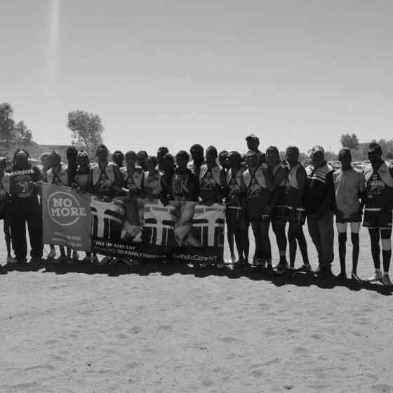 Santa Teresa Apurte 1 team linking arms before the match.